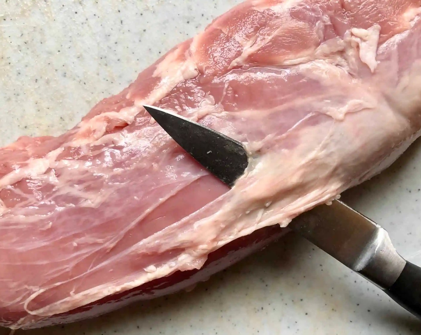 step 1 Remove the Silver Skin from Pork Tenderloin (1). Hold your knife at a slight angle under the layer of white skin and guide it along the outer edge of the tenderloin without removing too much of the meat.