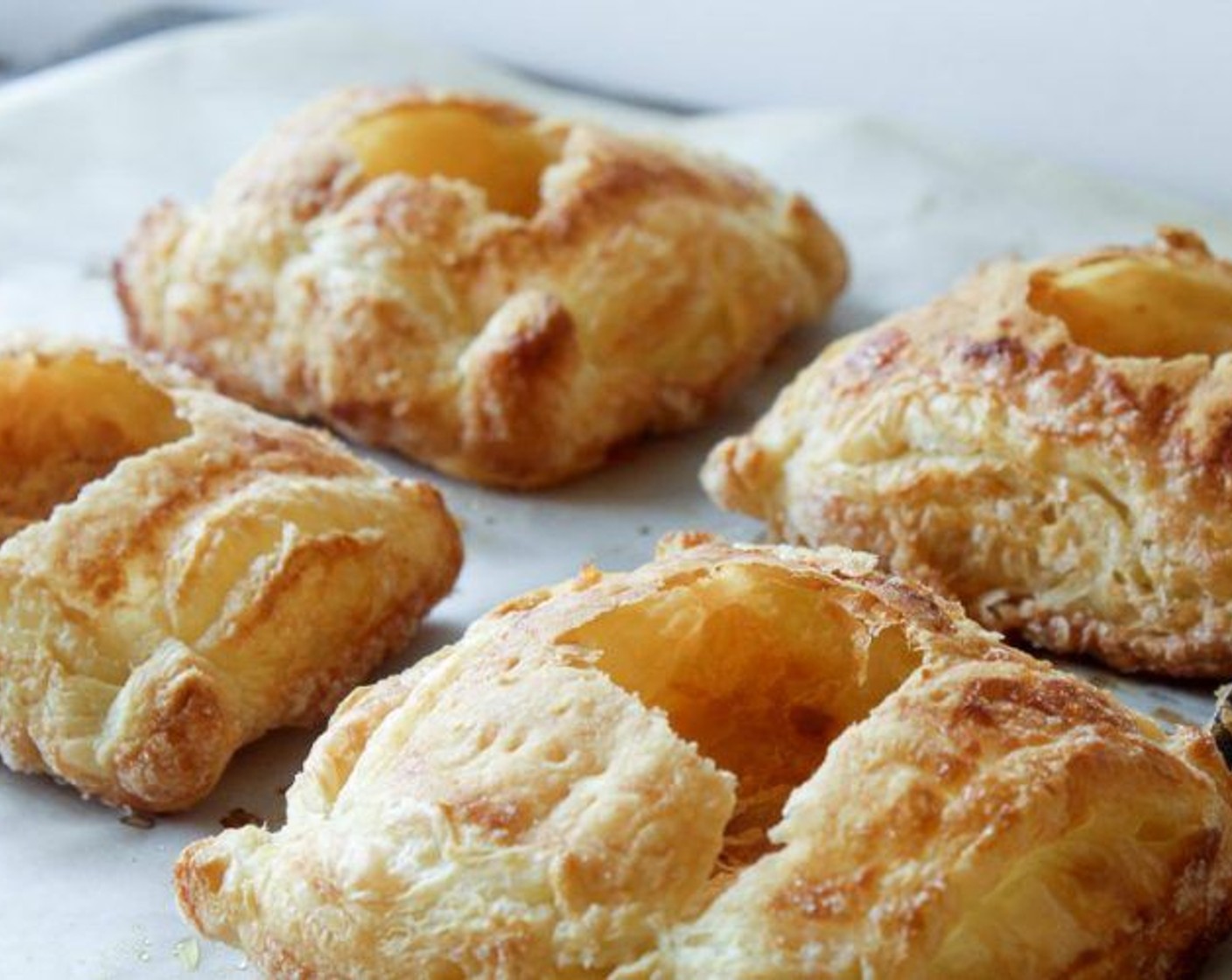 step 8 With a spoon, push down the center of each pastry, creating a well. Fill each pastry with approximately 2 tablespoons of Strawberry Jam (1 cup).