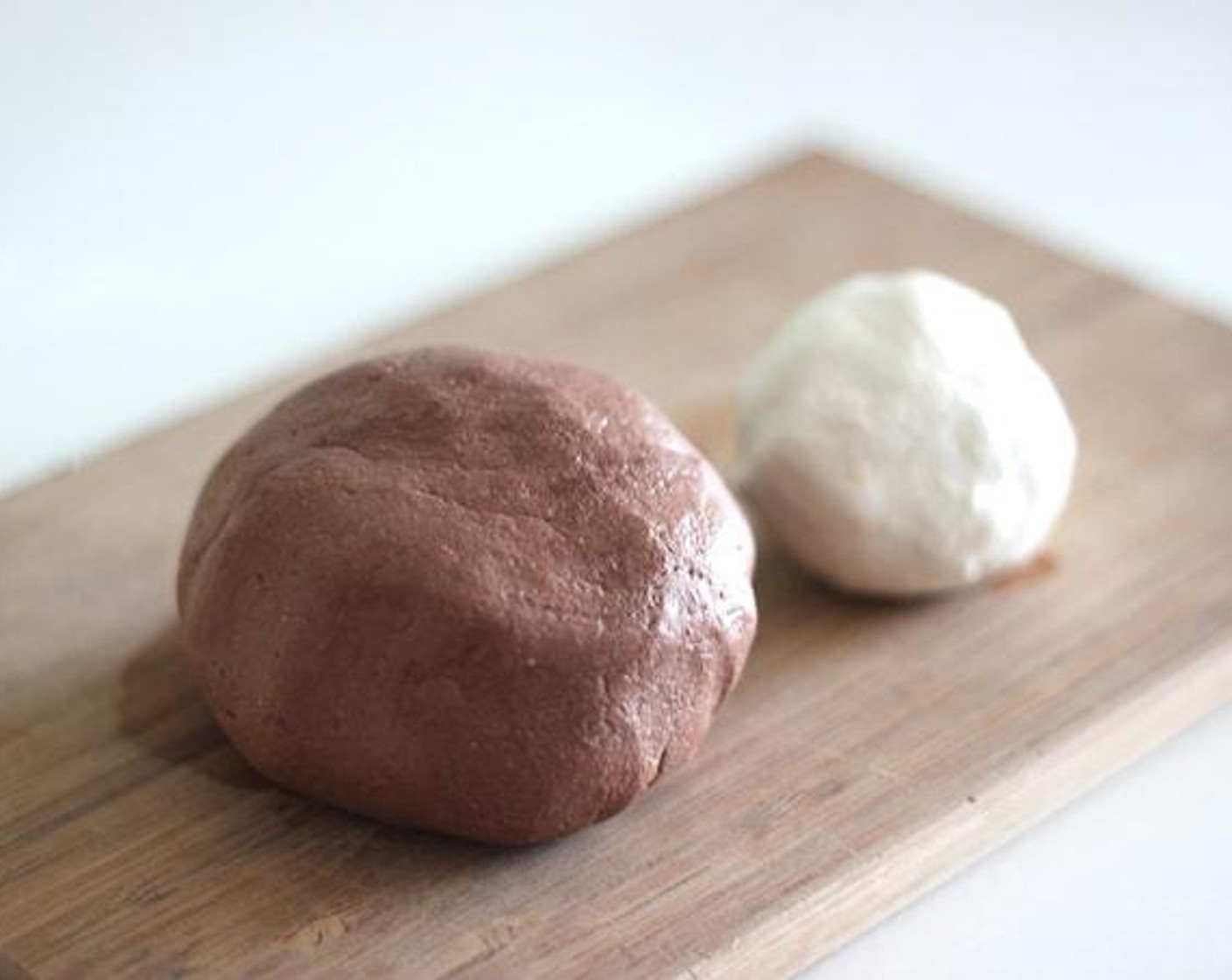 step 6 Take 1/4 of the dough and knead again with Unsweetened Cocoa Powder (3 Tbsp). The color of brown turns darker after boiling, so no need to put too much cocoa powder.