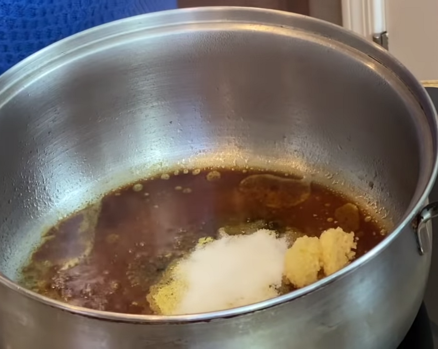 step 1 In a pot over medium heat, add Corn Oil (1/4 cup), Garlic (1 Tbsp), Adobo Seasoning (1 Tbsp), Salt (1 Tbsp), Ground Oregano (1/4 tsp), Soy Sauce (1/4 cup), and 1 Tbsp of juice from a Lime (1). Stir well.