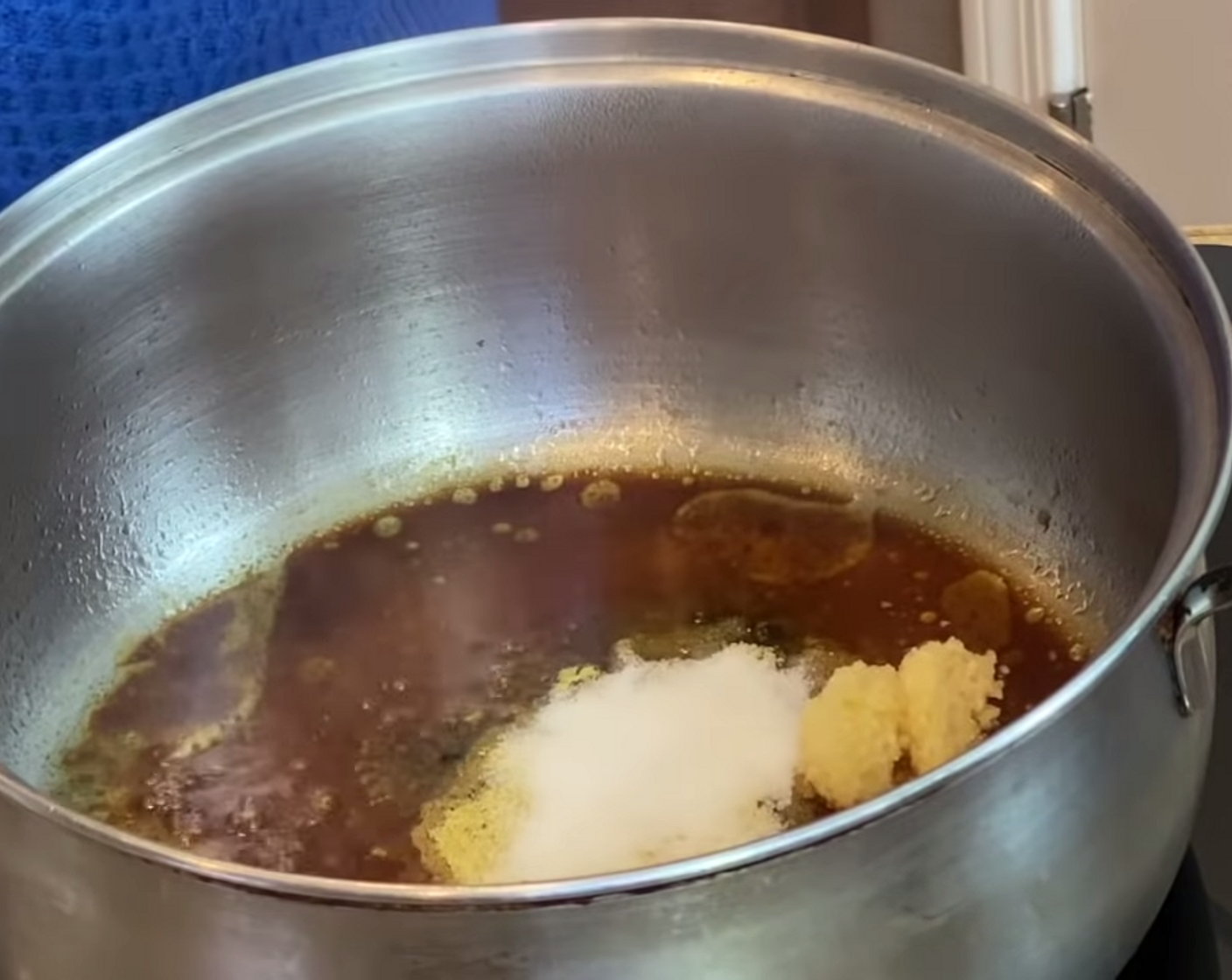 step 1 In a pot over medium heat, add Corn Oil (4 Tbsp), Garlic (1 Tbsp), Adobo Seasoning (1 Tbsp), Salt (1 Tbsp), Ground Oregano (1/4 tsp), Soy Sauce (4 Tbsp), and 1 Tbsp of juice from a Lime (1). Stir well.