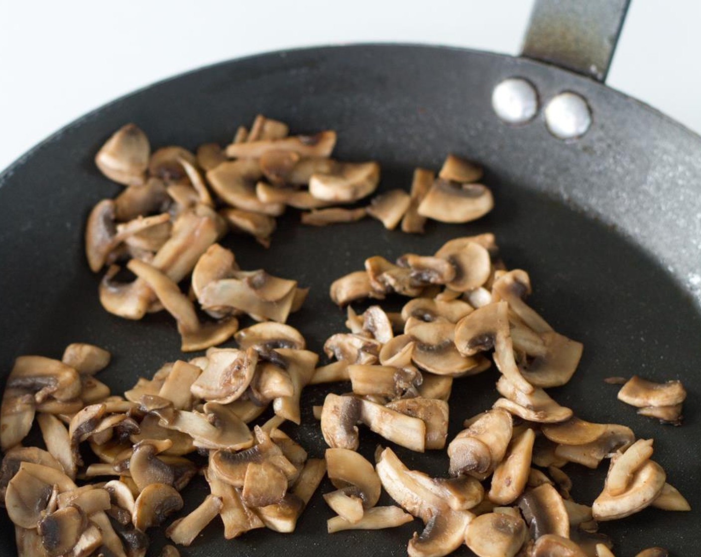 step 2 Heat a small skillet to medium heat high and add Olive Oil (1 Tbsp). Add Mushroom (1 cup) and season with Salt (to taste) and Ground Black Pepper (to taste). Move the mushrooms with a spatula frequently until they have reduced, then lower heat to medium-low.