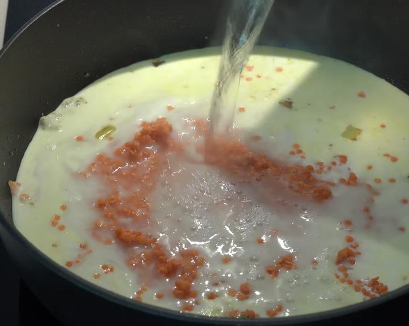 step 4 Add Tomato Paste (2/3 cup), Coconut Cream (1 can), and rinsed Lentils (1 cup). Add boiling Water (3 cups).