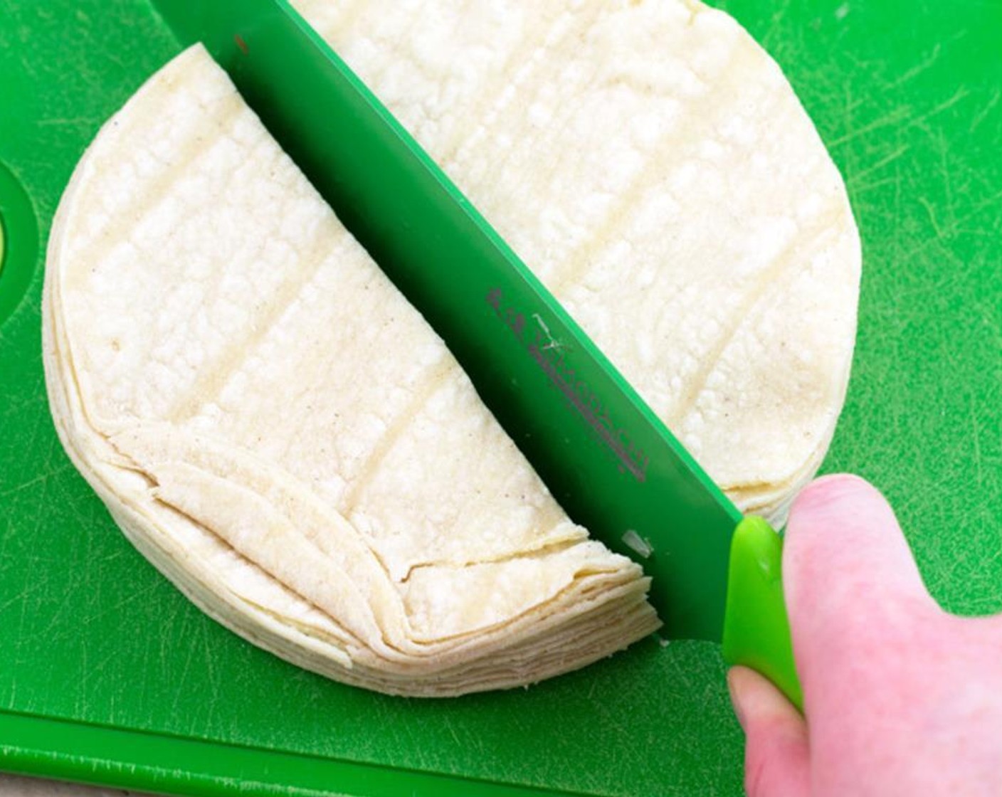 step 1 Begin by cutting the White Corn Tortillas (4 cups) in half.