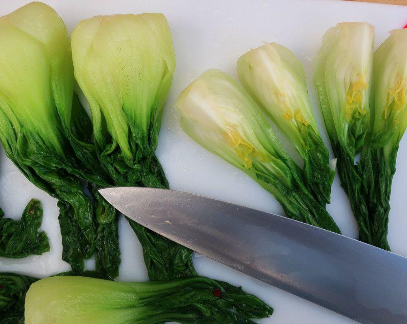 step 3 Once cooled off, drain and cut Blanched Bok Choy into quarters.