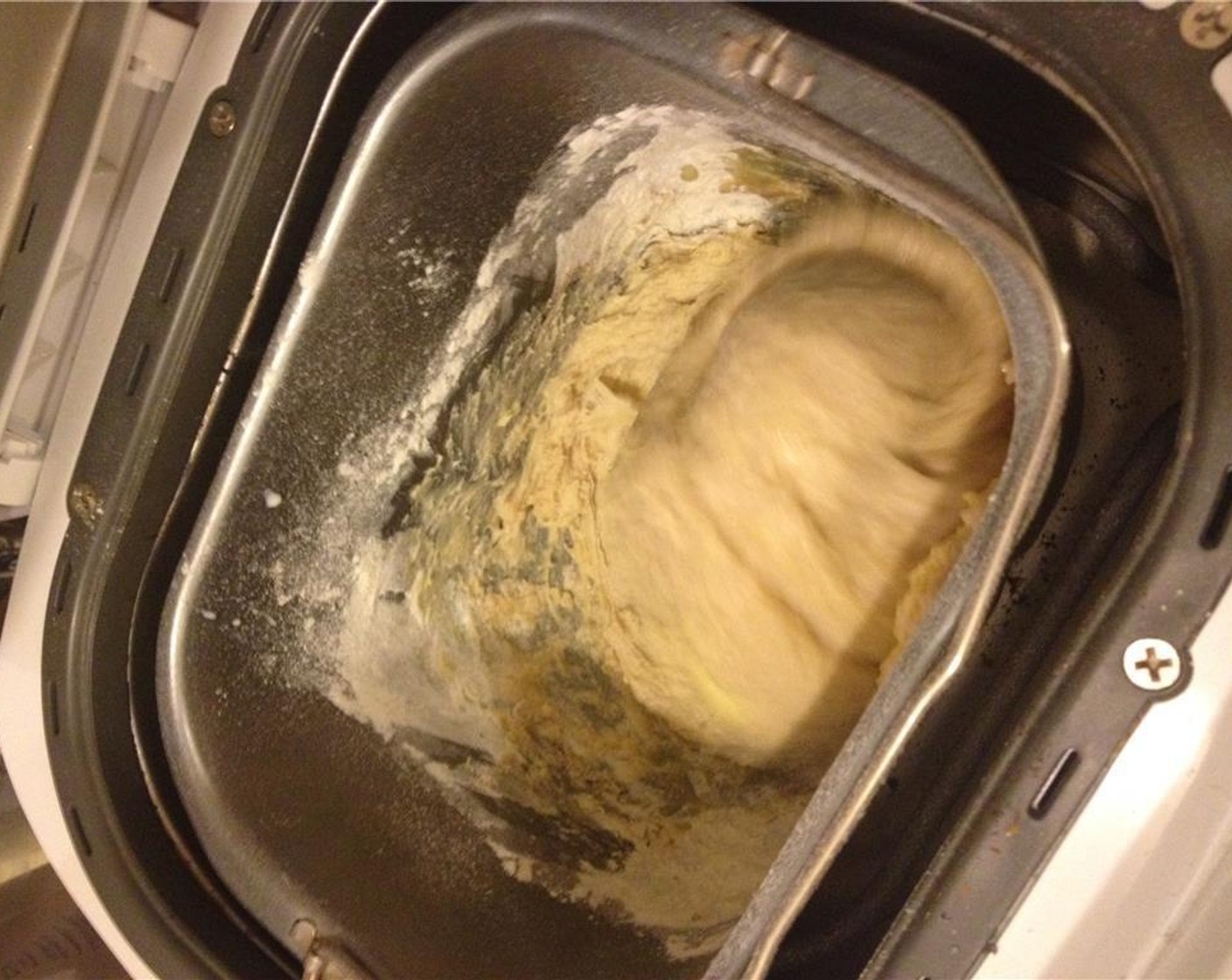 step 5 Add 125 ml of the Milk (1/2 cup) and the Eggland's Best Classic Egg (1) into the well. Knead until it becomes a dough and gluten has developed. Cover with a wet towel until it doubles in size, approximately 45-60 minutes.
