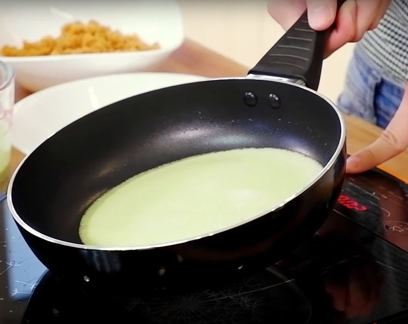 step 8 Once the pan is preheated, add in about ¼ measuring cup worth of batter into the pan and swirl evenly.