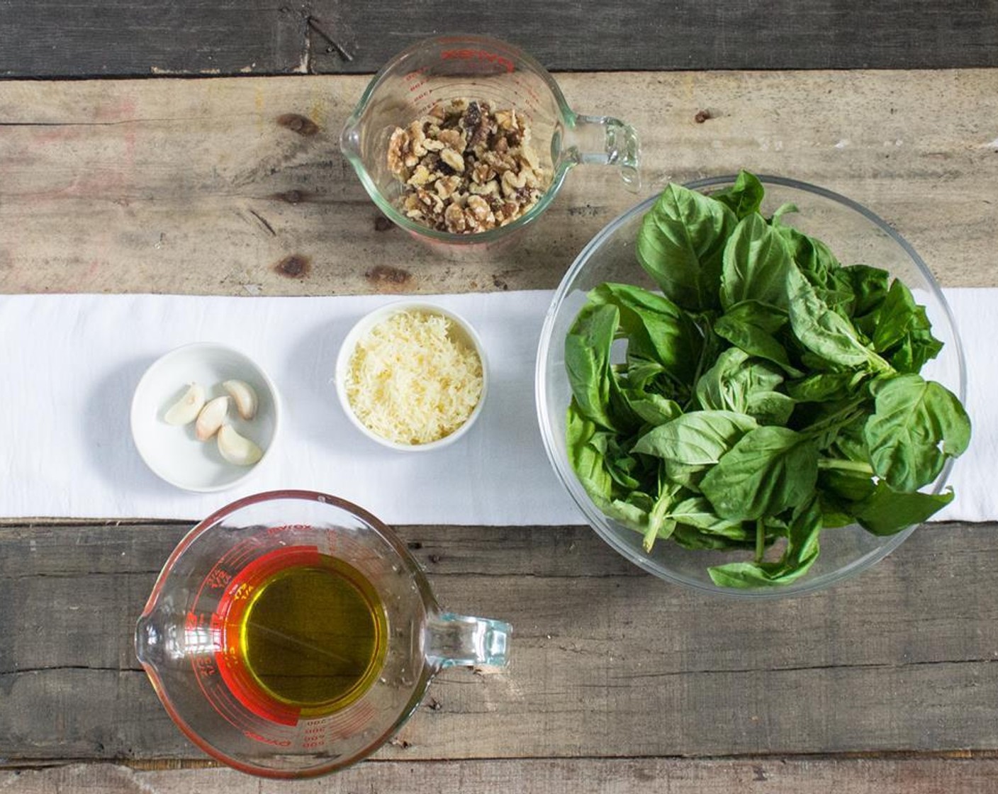 step 2 Blend the Fresh Basil Leaves (3 cups), chopped Walnuts (1 1/2 cups), grated parmesan cheese, and garlic in a food processor.