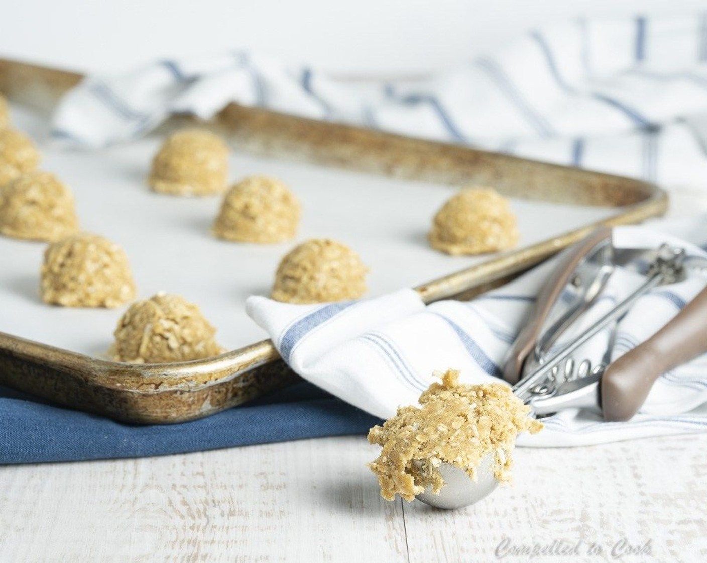 step 6 Line baking trays with parchment or silpat mat. Using a 1 ounce cookie scoop, scoop out dough, spacing 2 inches apart.