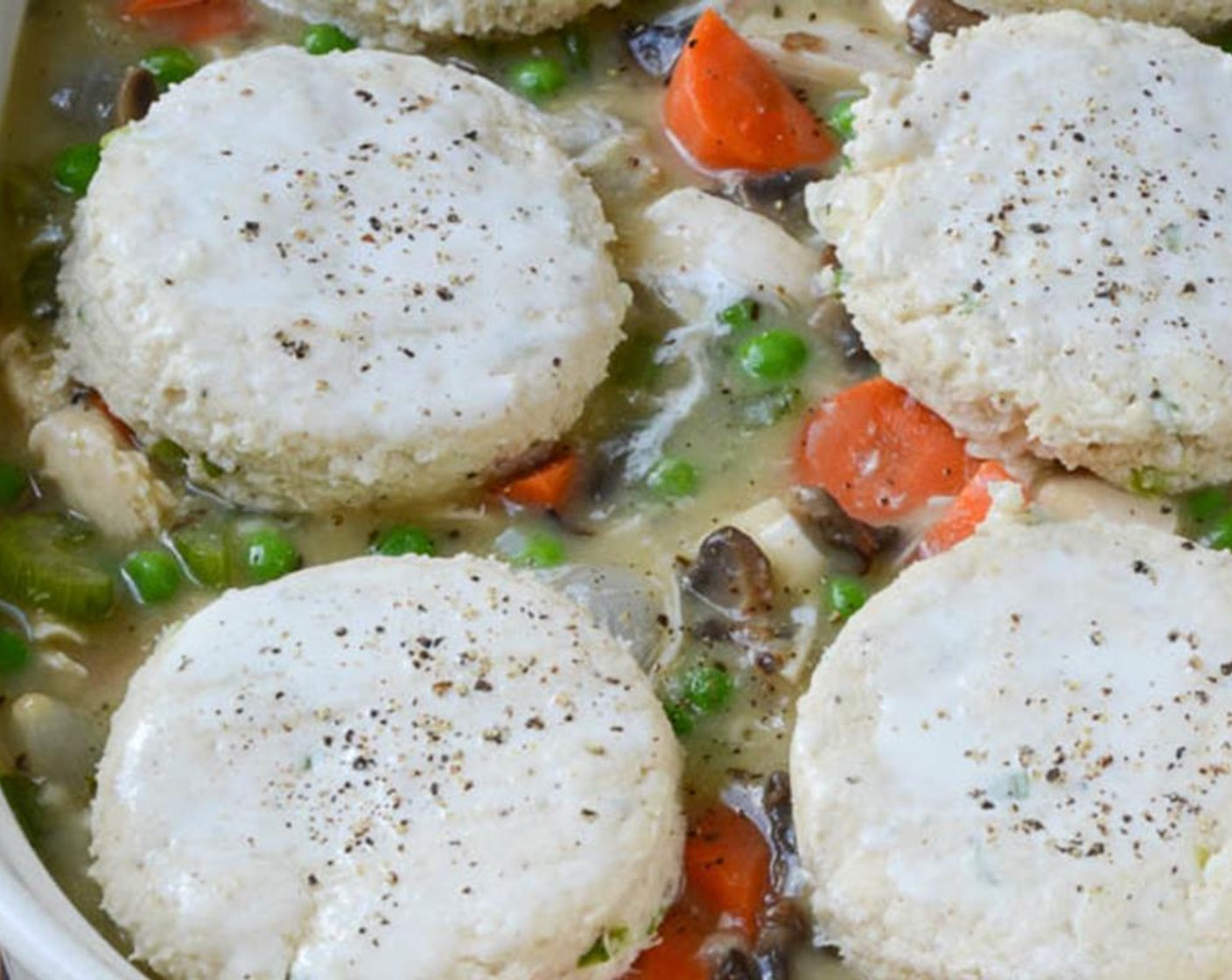 step 12 Spray a casserole dish with Vegetable Oil Cooking Spray (as needed) and transfer the turkey mixture to the dish. Arrange the biscuits on top of the filling.