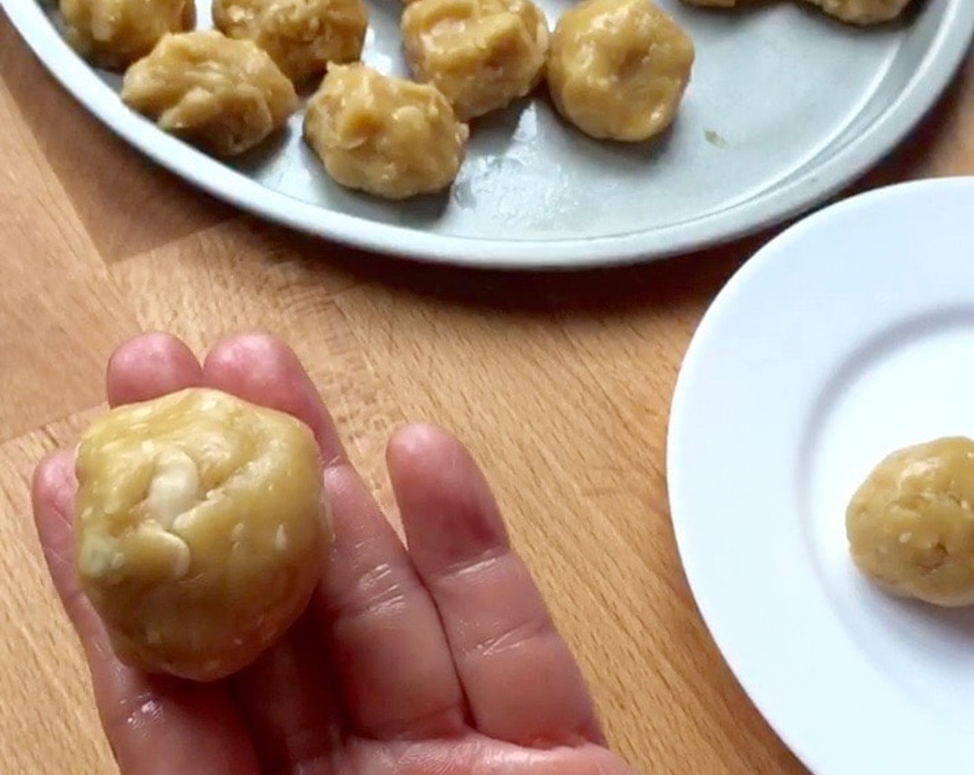 step 12 Then roll again into round shape. Repeat the same with the rest of the mooncake dough. And we're ready to shape the mooncakes.