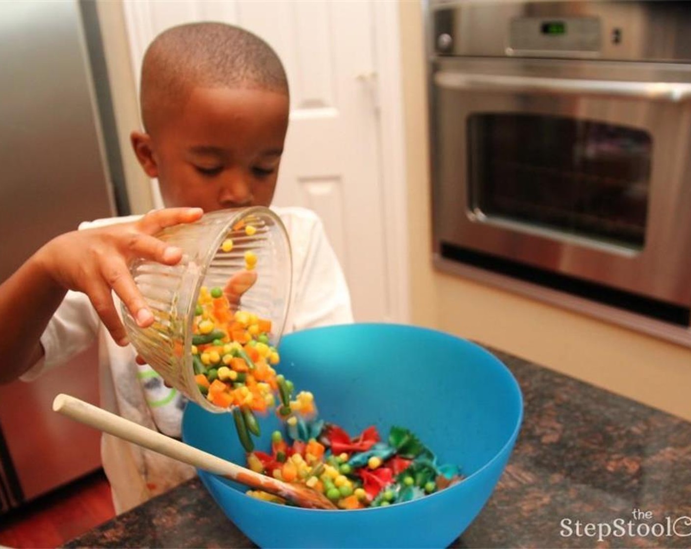 step 7 In a large bowl, toss cooled pasta and mixed veggies. Add Olive Oil (3 Tbsp), Italian Dressing (1/4 cup), Salt (to taste), and Ground Black Pepper (to taste) to the bowl.