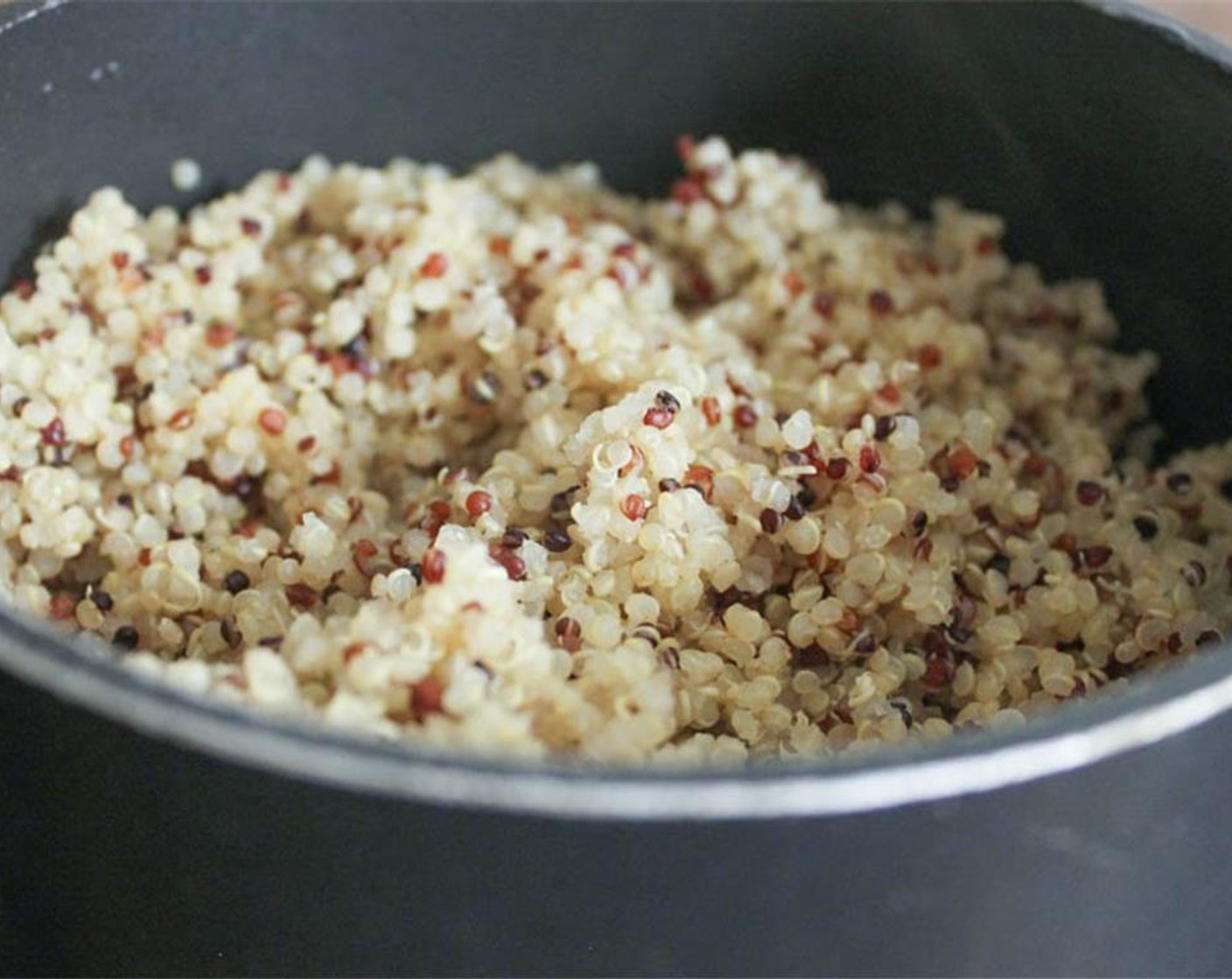 step 2 In a small pot, bring the Quinoa (1 1/4 cups) and 1 3/4 cups plus 2 tablespoons water to a boil. Lower to a simmer and cook, covered, for 15 minutes until all of the water has been absorbed. Let the quinoa rest, covered, for 10 minutes. Fluff with a fork.