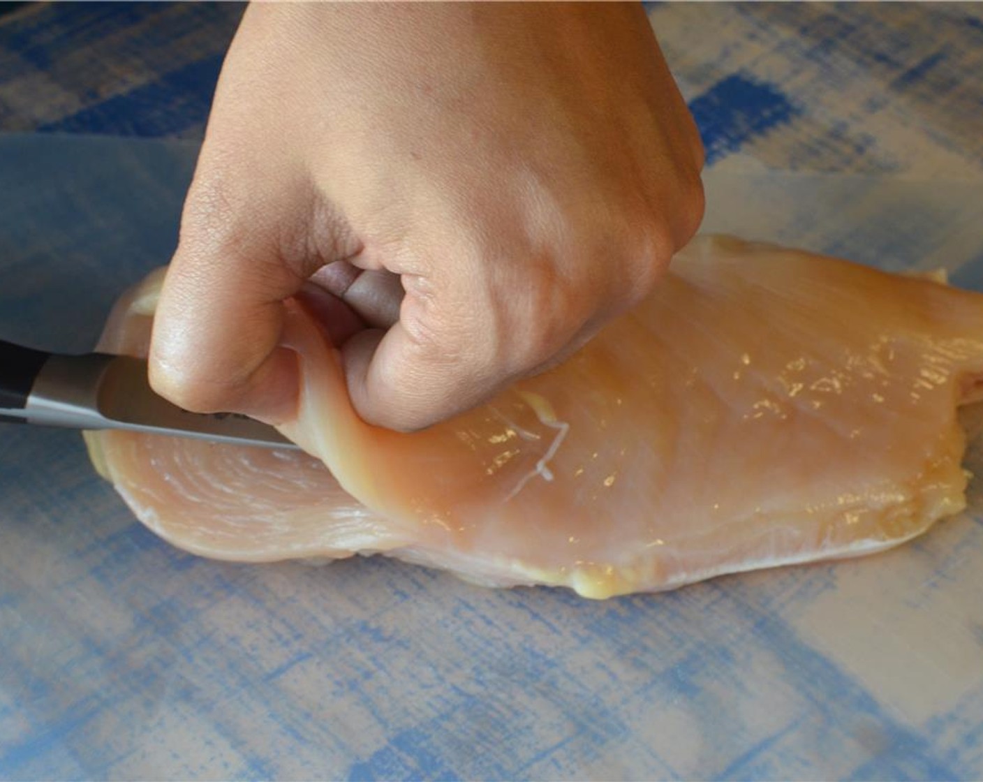 step 6 To stuff the Chicken Breasts (4) using a sharp knife, find the thickest part of the chicken breast near the top and make a slit in the middle. Then, pushing your knife in the slit, create a pocket trying to keep the initial slit small.