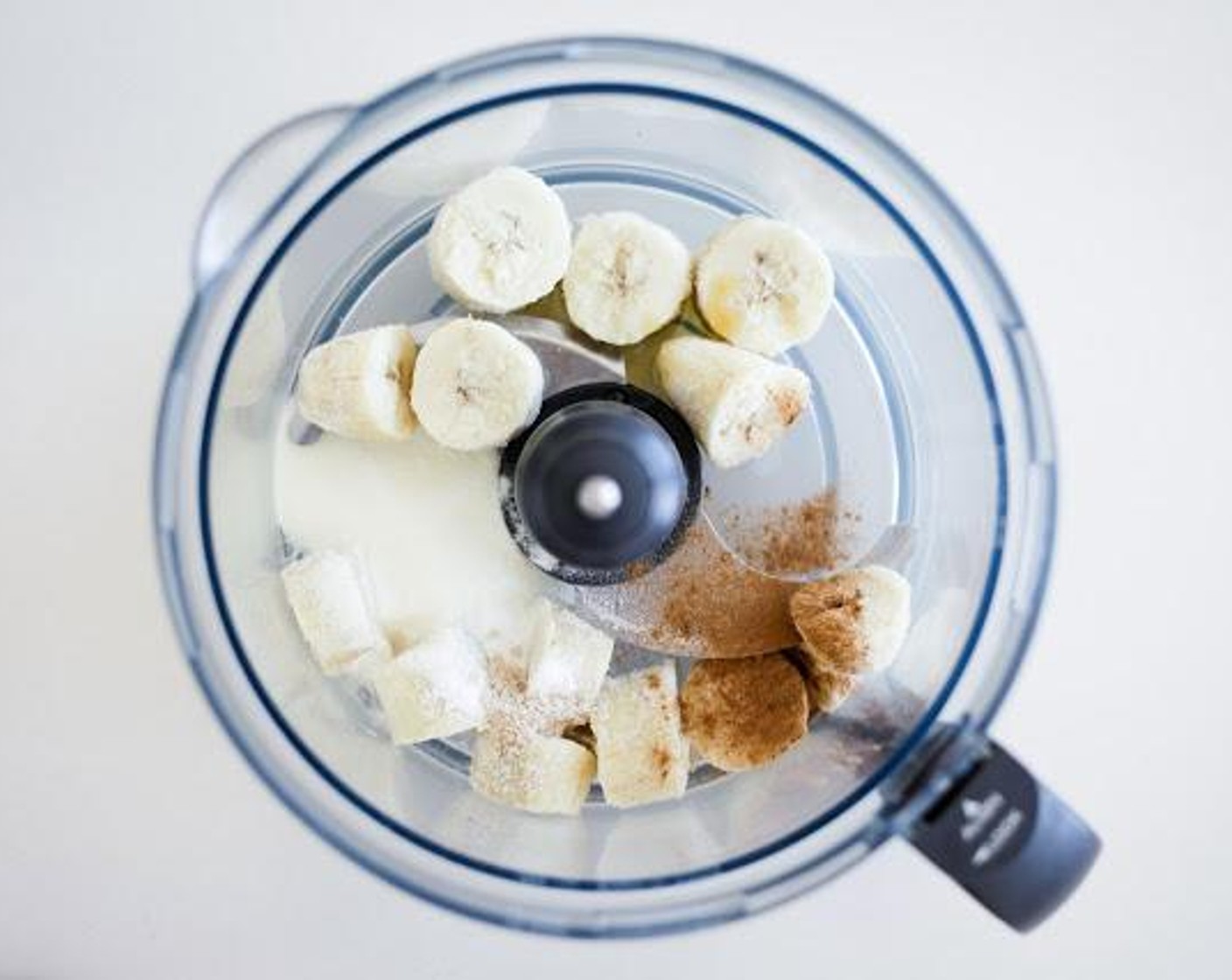 step 1 Place the Bananas (2), Hydrolyzed Collagen (2 Tbsp), Vanilla Extract (1 Tbsp), Slippery Elm Powder (1/2 tsp), and L-Glutamine Powder (1/2 tsp) in the food processor.