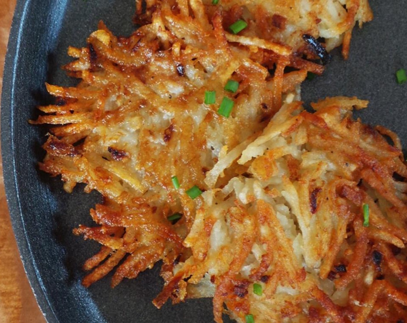 step 5 Scoop 1/4 cup of the potato mixture and place in hot oil. Flatten with a spatula. Fry 2 minutes on each side or until crispy brown. Transfer to a plate lined with a paper towel to drain the excess oil. Repeat again with the remaining mixture and oil.