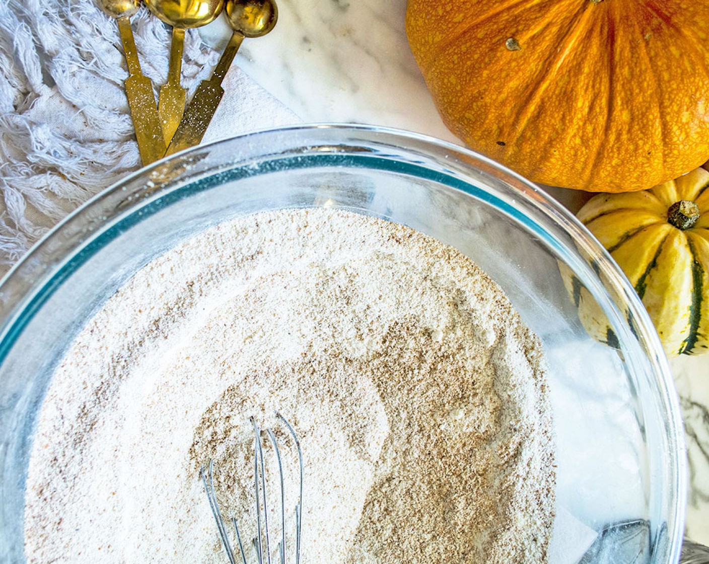 step 1 Mix Almond Flour (1 1/4 cups), Arrowroot Starch (3/4 cup), Cassava Flour (1/3 cup), Baking Powder (1/2 Tbsp), Baking Soda (1/4 tsp), Sea Salt (1/2 tsp), Ground Cinnamon (1 tsp), Pumpkin Pie Spice (1/2 Tbsp), and Coconut Sugar (1/2 cup) in a large bowl.