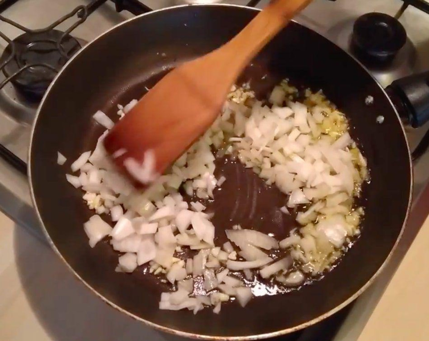 step 5 When everything is hot, add the onions and sauté them a bit.