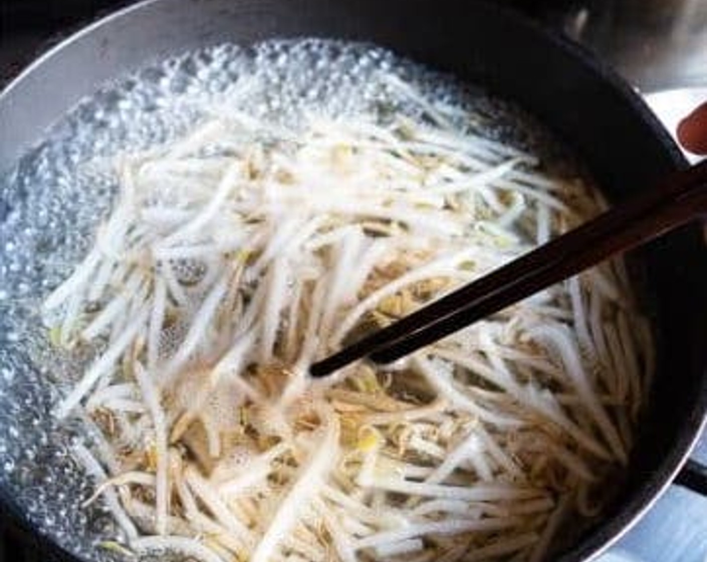 step 2 Wash the Bean Sprouts (1 1/4 cups), add them to a pan, cover with water. Boil them on high heat for 1-2 minutes. You only want them lightly cooked with a bit of crunch still.