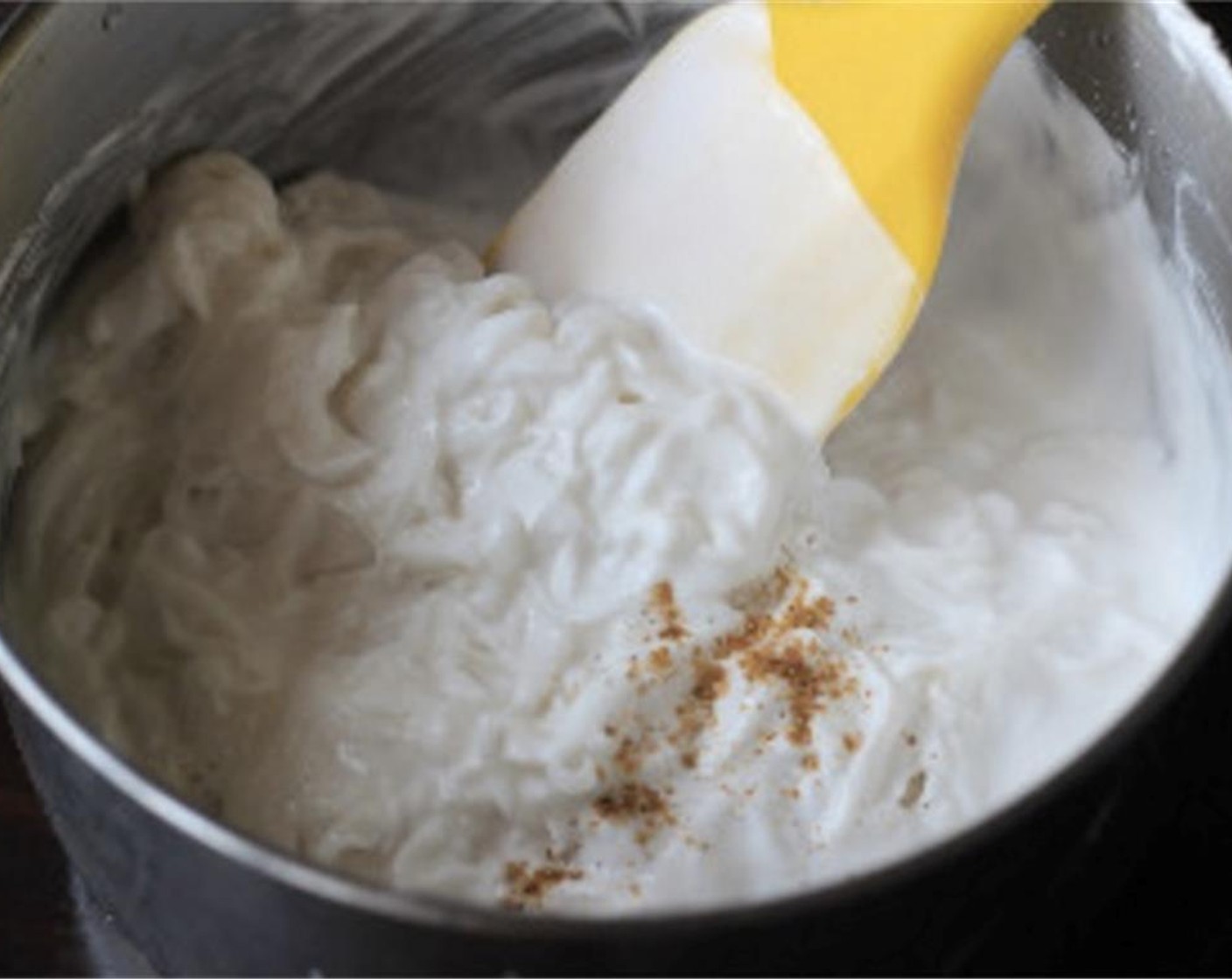 step 5 Squeeze the water out and transfer to another large mixing pot. Mix all the Rice Flour (2 cups) with the water squeezed out from the radish and the left Water (3 1/3 cups). Add radish shreds and Chinese Five Spice Powder (1 tsp), Granulated Sugar (1/2 tsp), Salt (1/2 Tbsp), and Shaoxing Cooking Wine (1 Tbsp). Mix well and heat over medium fire to boil.