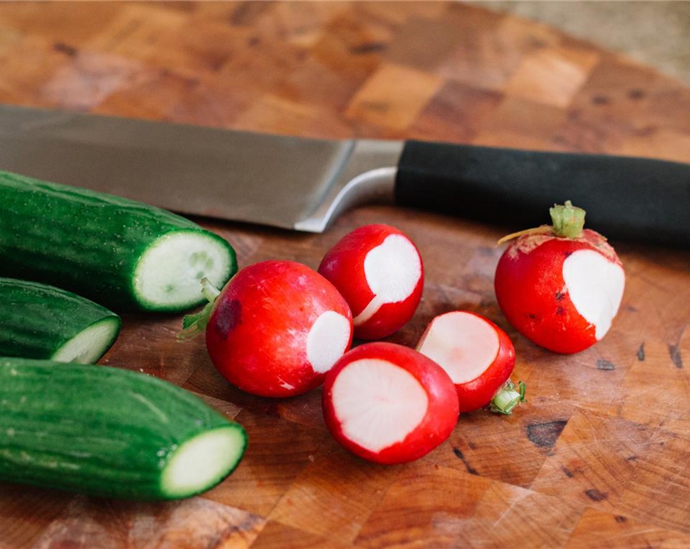 step 7 Slice the ends off the Baby Red Radish (5) and Persian Cucumbers (2).