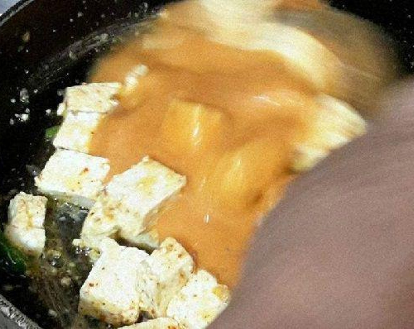 step 5 Add Red Chili Powder (1 tsp), Salt (to taste), Green Cardamom Pods (2), Ground Coriander (1/2 tsp), Fresh Ginger (1 tsp), Green Chili Pepper (1) and 2 tablespoon of puree. Add cubes of Paneer (to taste) and toss to combine.