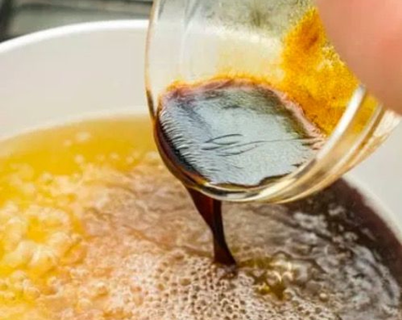 step 5 In a small bowl, combine Apple Cider Vinegar (1/2 cup), Soy Sauce (2 Tbsp), Brown Sugar (1 Tbsp), Sesame Oil (1 Tbsp), and Dark Soy Sauce (1 tsp). Pour this sauce mixture into the pot of chicken stock.