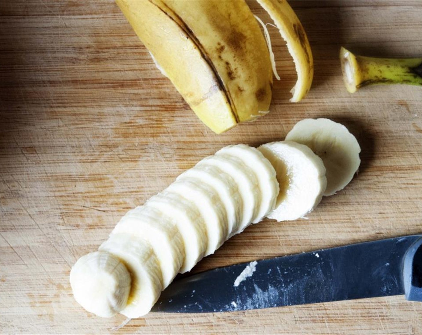 step 1 Melt the Unsalted Butter (1/4 cup) then let it cool. Peel and slice up half of the ripe Bananas (2).