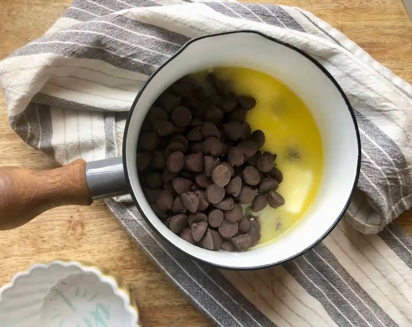 step 2 Using a double boiler, melt the Butter (3/4 cup) and Semi-Sweet Chocolate Chips (1 cup) over medium heat. Allow mixture to cool to room temperature.