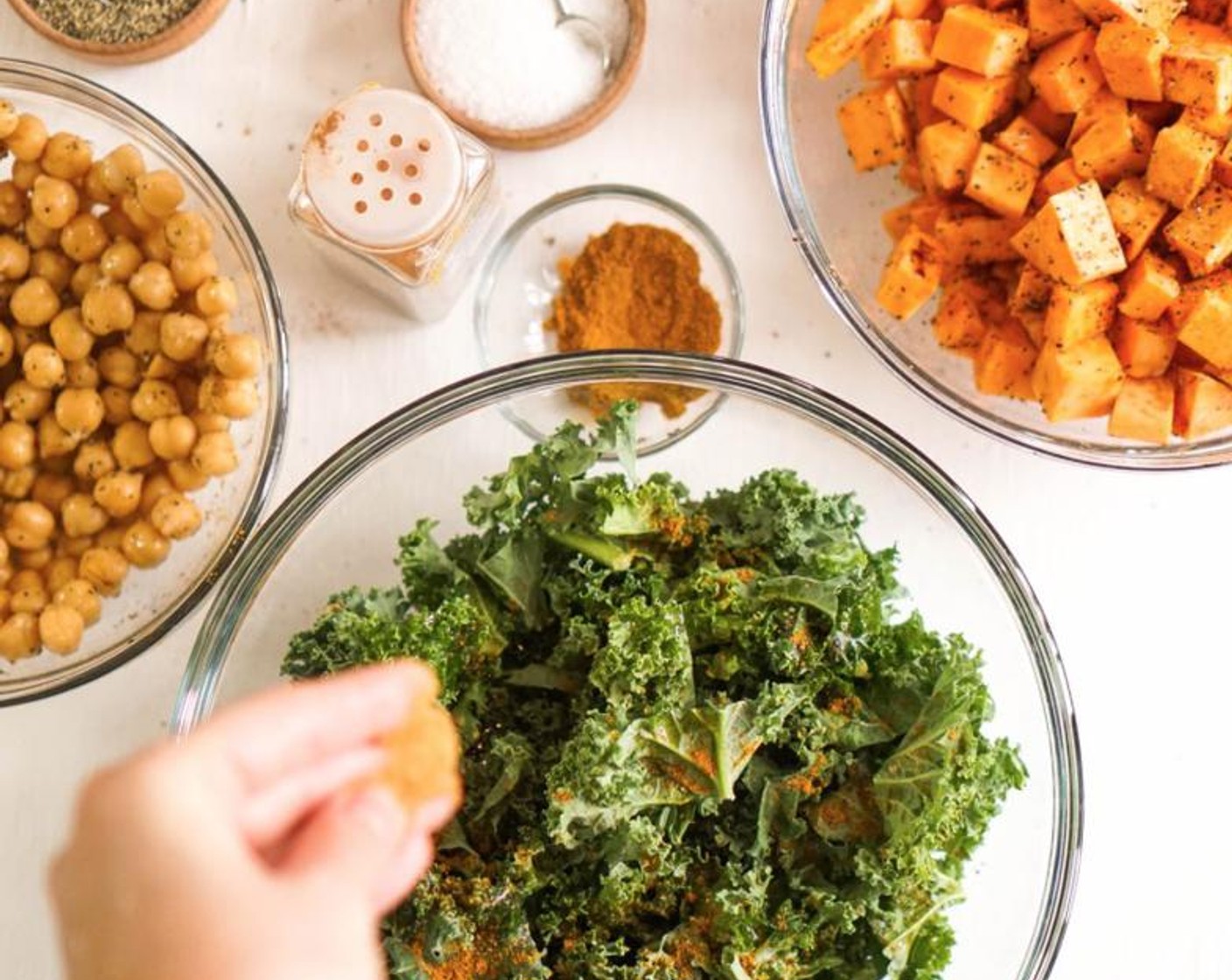 step 6 In the same mixing bowl, add the chopped Kale (2 cups). Drizzle (or spray) with Olive Oil (as needed) until glistened. Season with Garlic Salt (to taste), Ground Black Pepper (to taste), Curry Powder (to taste), and a dash of Coconut Sugar (to taste).