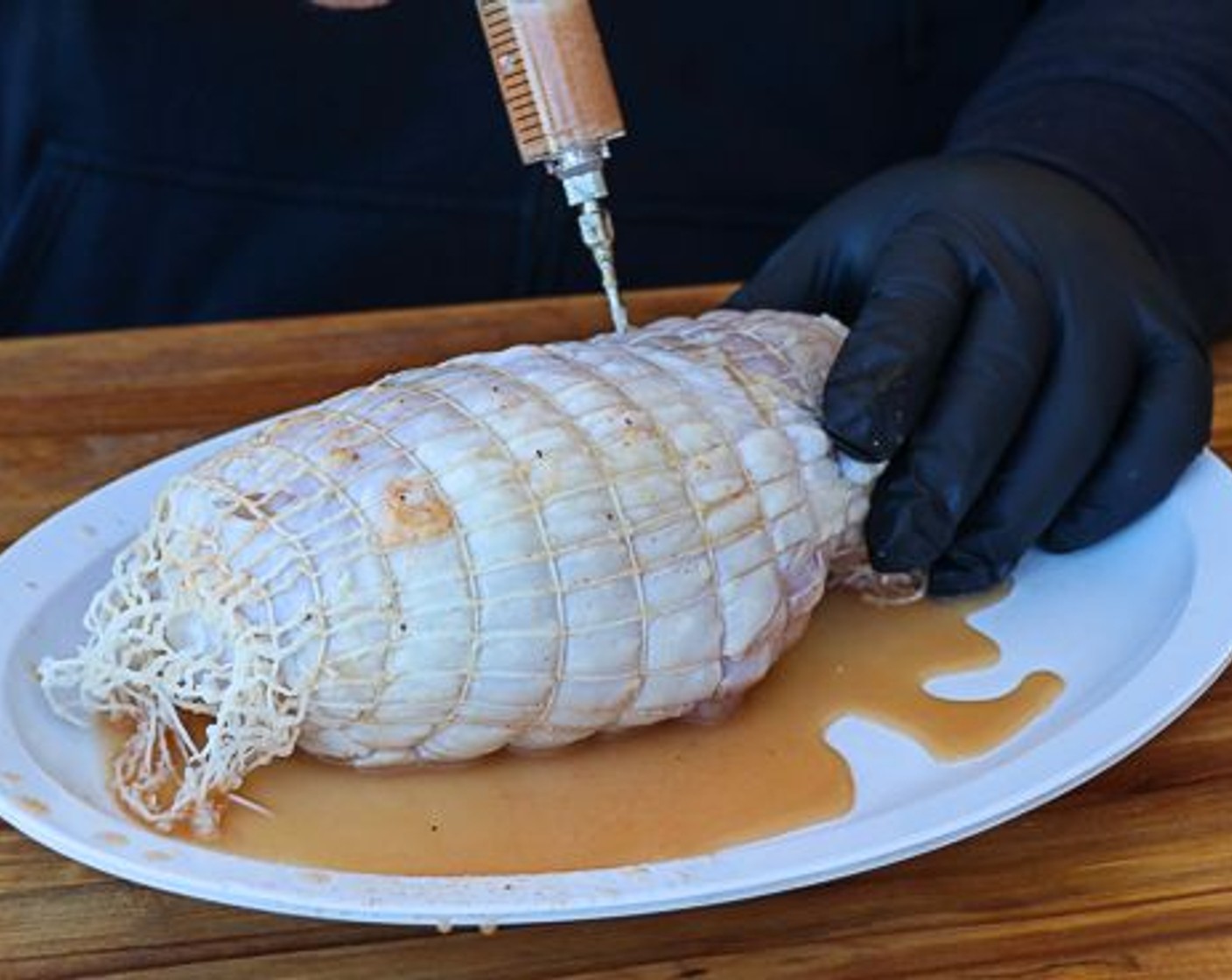 step 2 Combine Butter (1/2 cup), Chicken Broth (8 fl oz), Hot Sauce (1 Tbsp), and Cajun Seasoning (1 Tbsp) in a mixing bowl. Inject the mixture into the Turkey Breast (1) spacing out the injection sites for even coverage.