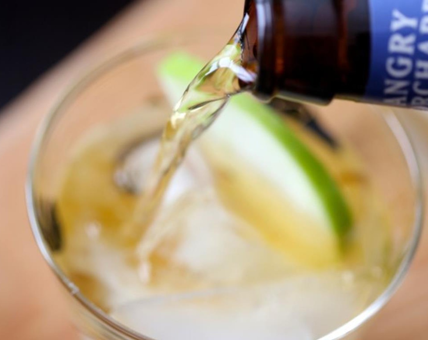 step 3 Pour a tablespoon of simple syrup into the glass along with one shot of Rum (6 fl oz), Lime (1/4) and fill with Hard Apple Cider (24 fl oz).