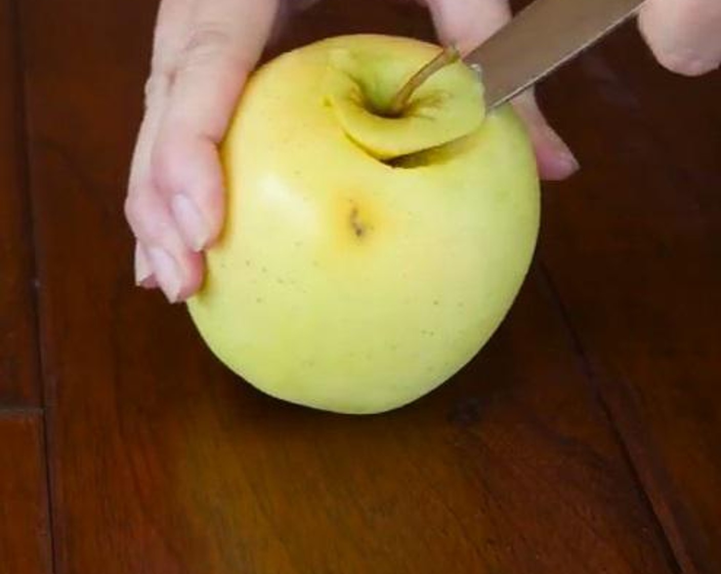 step 2 Core Apples (2) halfway and make a wide opening or pocket into the apple. Remove all the seeds.