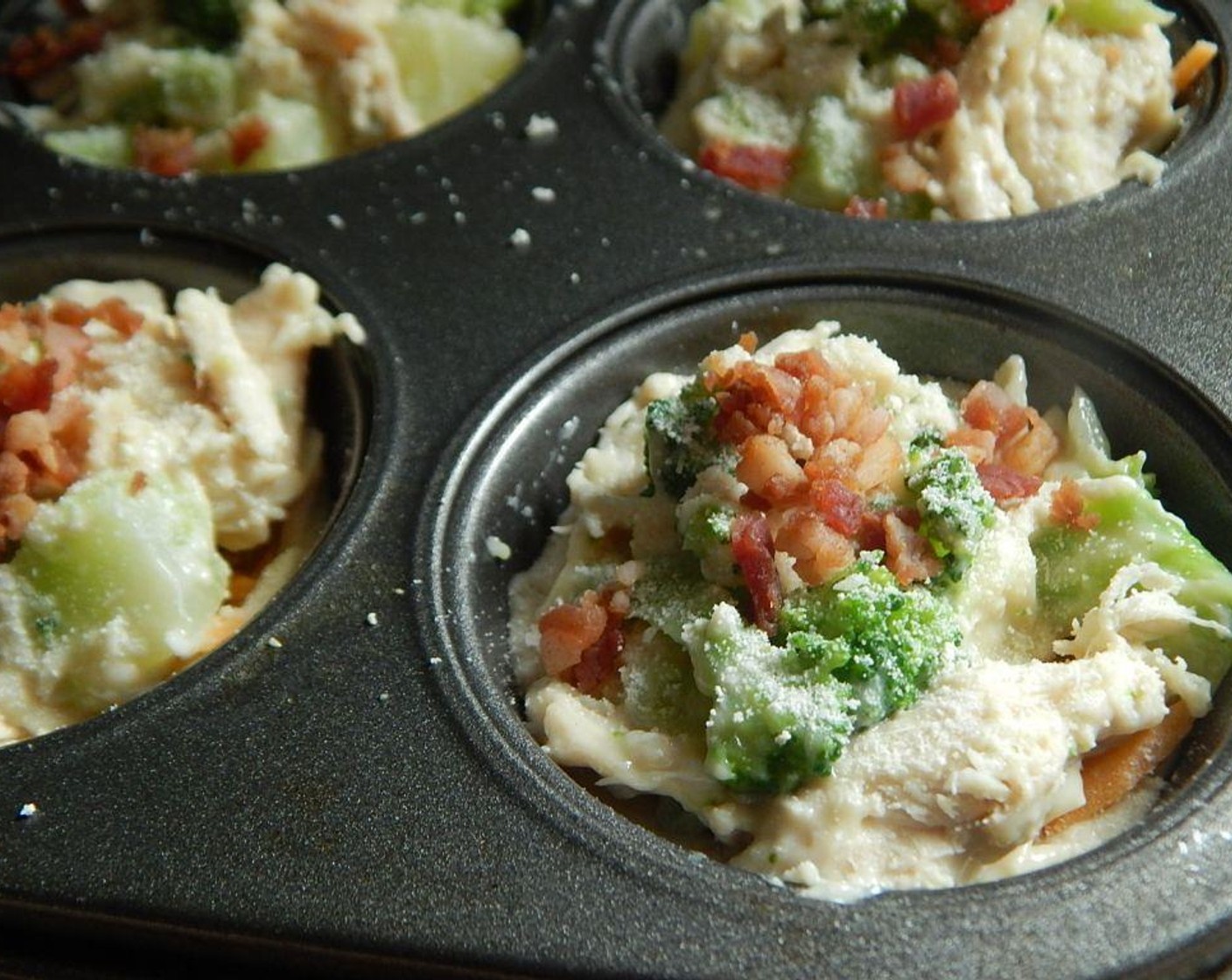 step 6 Dived chicken mixture into your 10 biscuit cups, top with your Parmesan Cheese (1 Tbsp) and Bacon Bits (2 Tbsp).