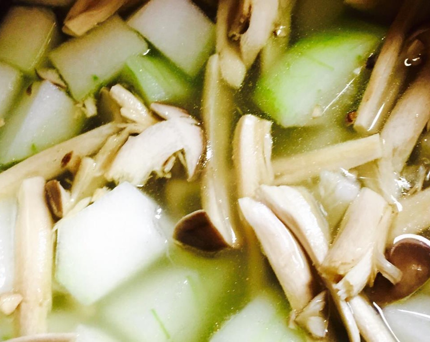 step 4 Bring the Vegetable Stock (2 cups) to a boil and add the winter melon, mushrooms, ham, and Salt (1 tsp). Reduce to simmer for 20 minutes or until melon is slightly soft.