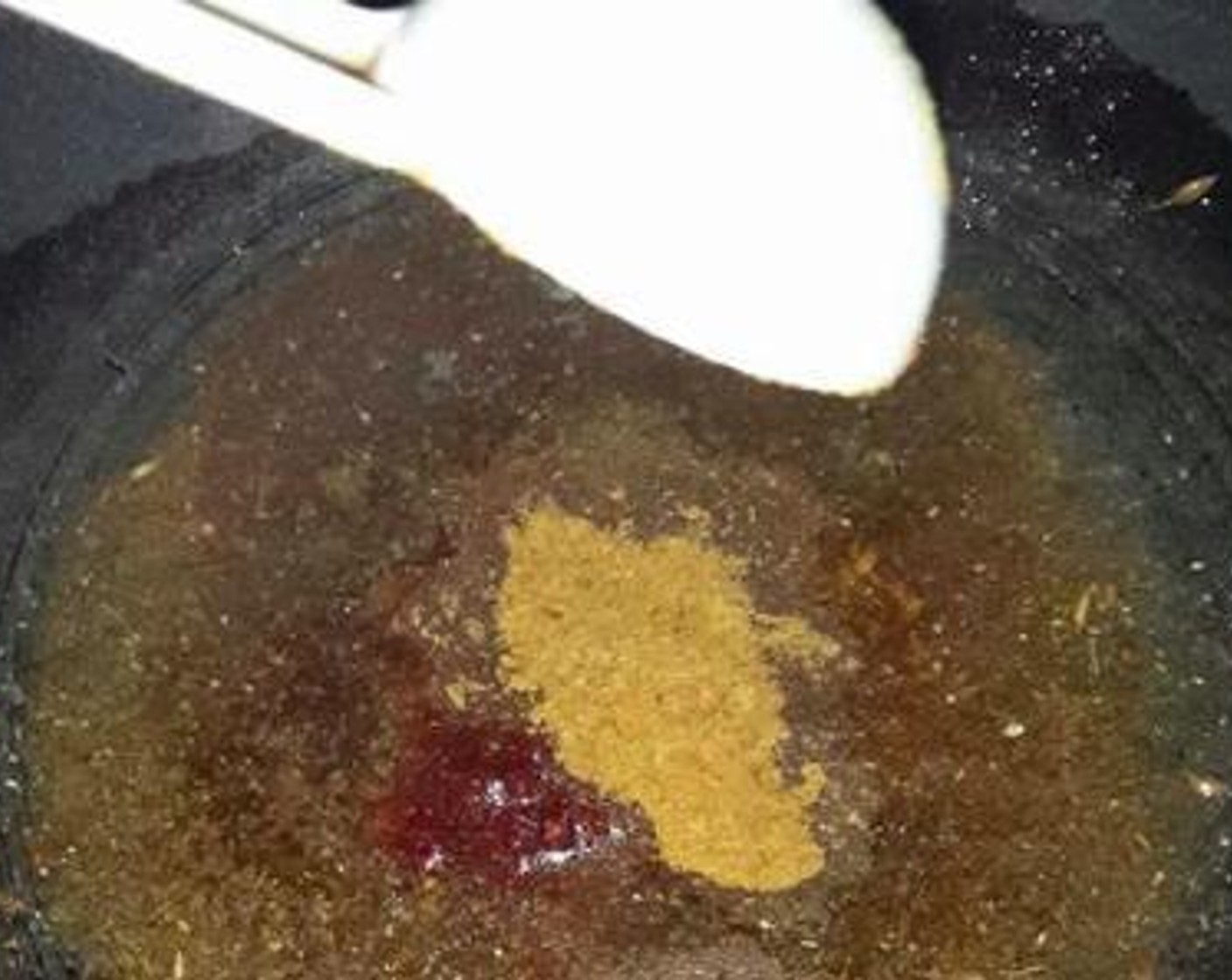 step 6 Add Asafoetida (1 pinch), Salt (to taste) and Chaat Masala (1 tsp), Roasted Cumin Powder (1 tsp), Garam Masala (1/2 tsp), Kashmiri Red Chili Powder (1/2 tsp) and Mango Powder (1/2 tsp). Return to heat and stir for 30 seconds. If using tamarind water, add it here.