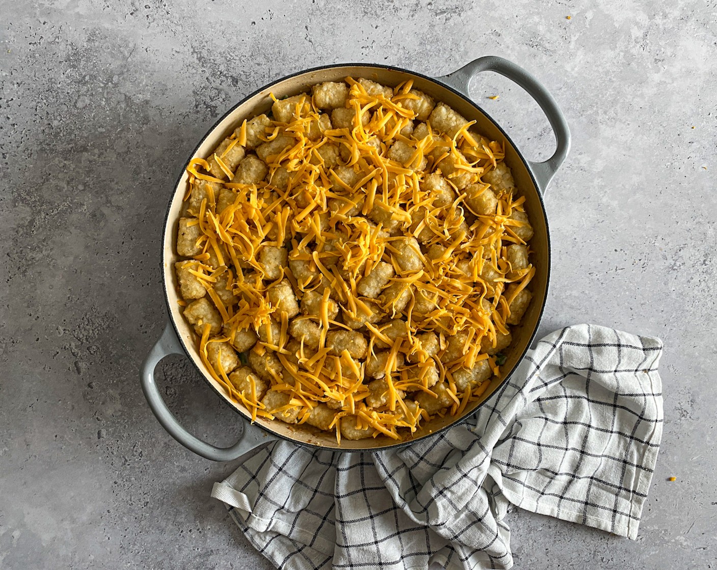 step 8 Top with Shredded Cheddar Cheese (1/2 cup) and bake for 25 minutes until tater tots are golden and crispy.