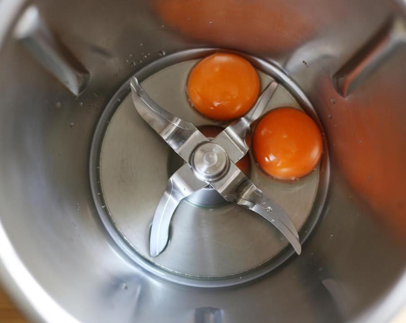 step 1 For the Gochujang Mayo, combine the yolks of the Eggs (2) and White Wine Vinegar (2 Tbsp) in a high speed blender and blend on high until combined.