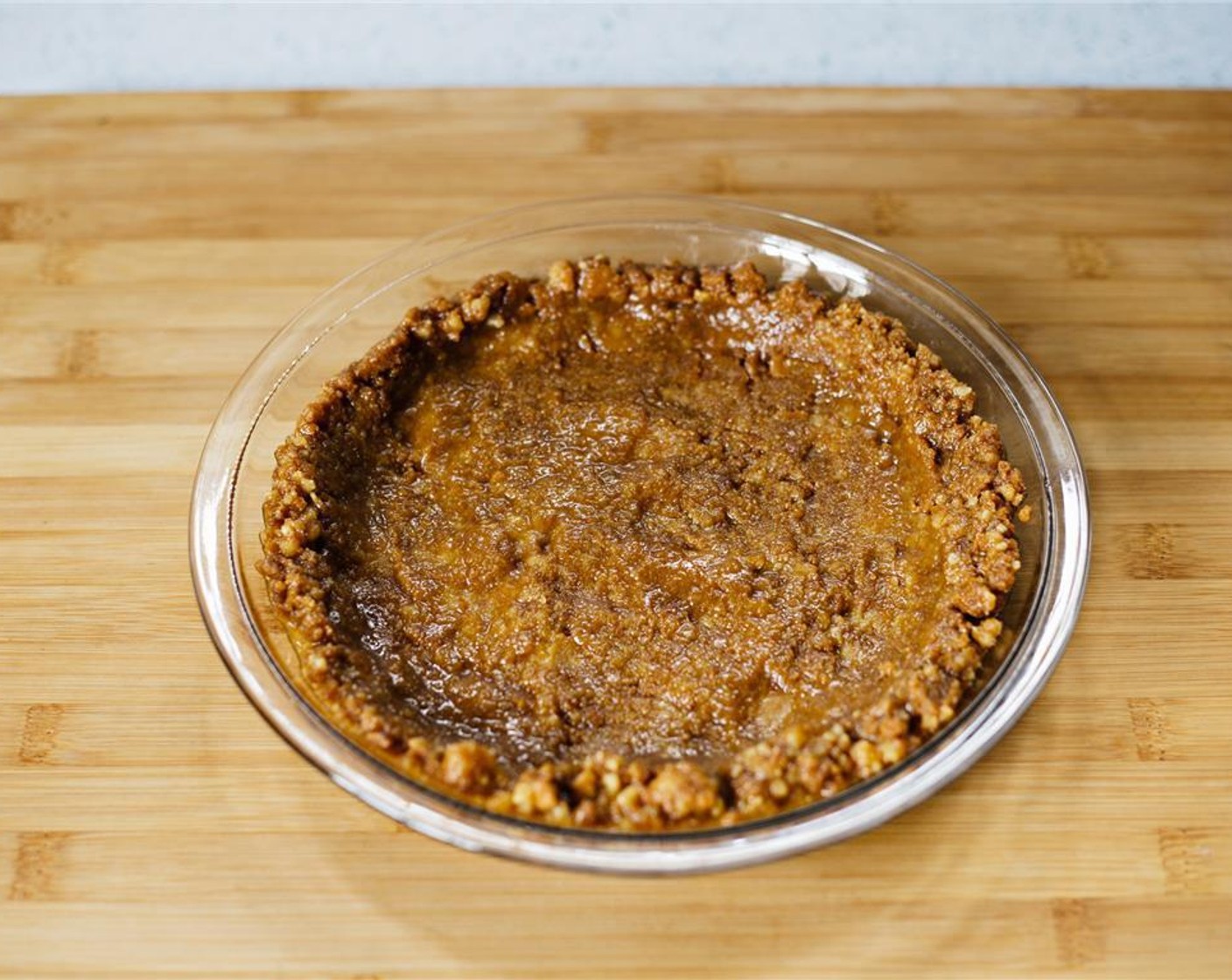 step 3 Press mixture into a pie tin, and slightly up onto the sides to form a crust.