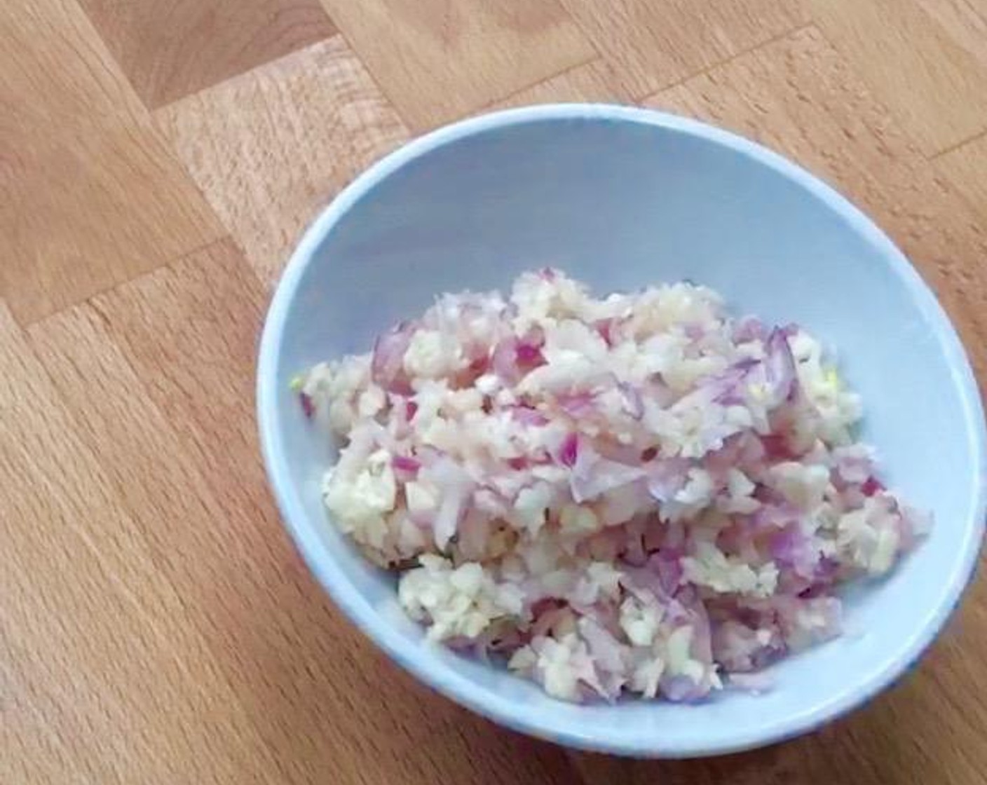 step 2 Next, peel and chop Garlic (50 cloves) and Shallot (1/3 cup).