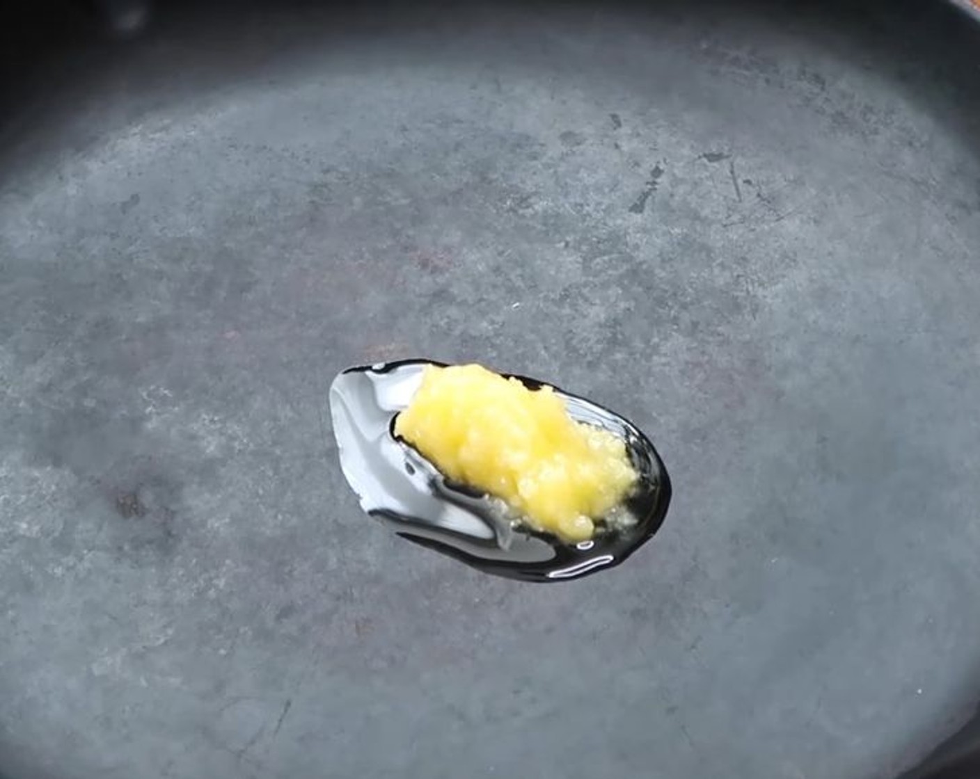 step 2 In a medium-size pan, heat Non-Dairy Butter Flavored Coconut Oil (1 Tbsp) over medium-high heat. Add Onion (1) to the pan, and sauté until translucent, about 3 to 5 minutes.