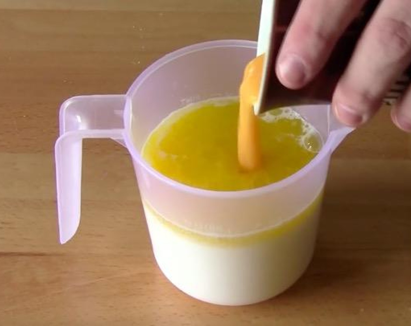 step 3 Put the Milk (1 1/2 cups) into a jug. Add Butter (2 oz) and Eggland's Best Classic Egg (1) into the same jug and mix them together.