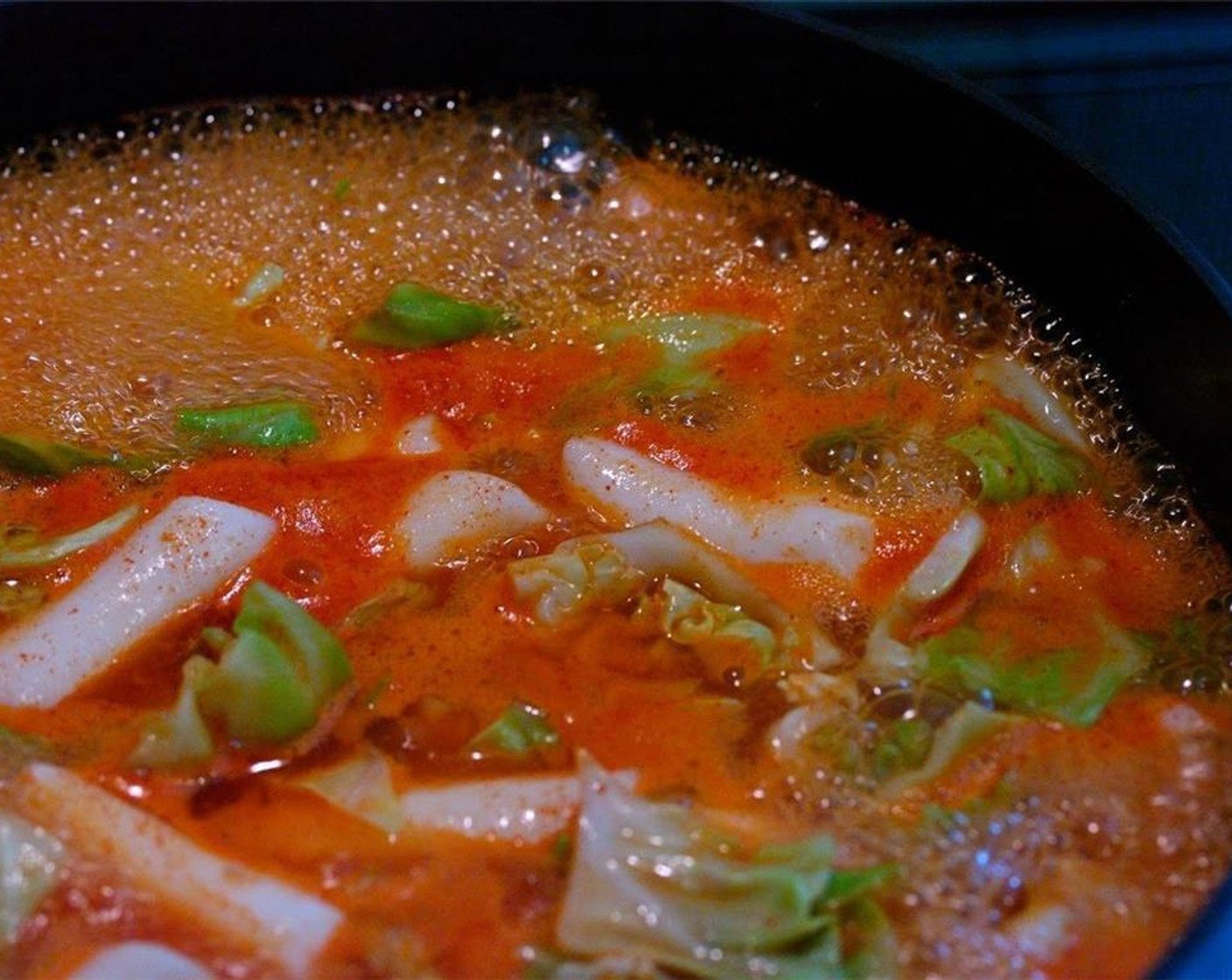 step 14 Let them boil first and simmer over medium-low heat for 10 min, until the rice cakes and the cabbage soften. The sauce will get slightly thicker, too.