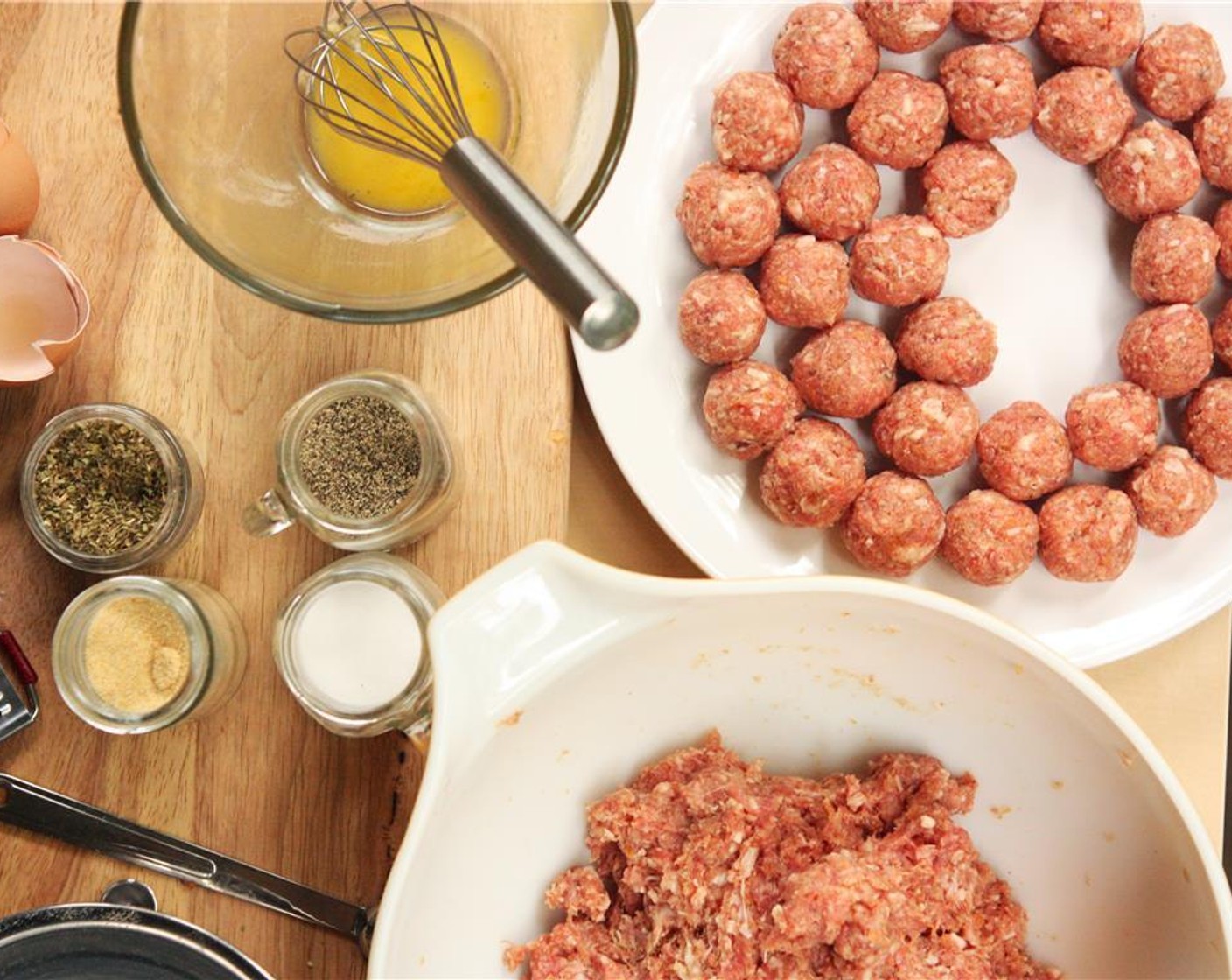 step 2 Working with small sections of the meat mixture, roll each section between your palms to create a ball about 1″ in diameter. Continue until the entire mixture has been rolled into balls.