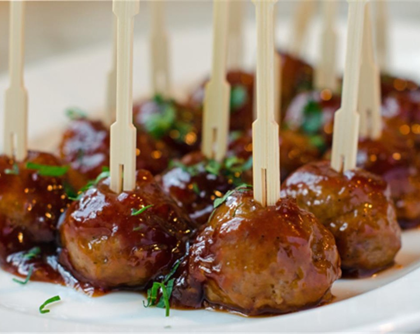 step 10 Transfer the meatballs to a serving platter, spear with toothpicks and spoon the sauce over top. Garnish with Fresh Parsley (to taste), if desired. Serve warm and enjoy!