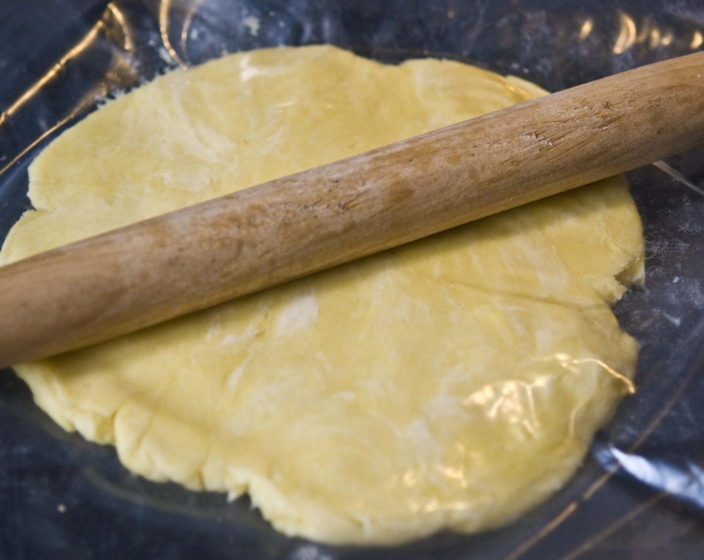 step 4 With a rolling pin, flatten the dough a bit, and transfer it into a freezer until you are ready to use it. Before making the pie, take the crust from the freezer and let it sit for about 15 minutes.