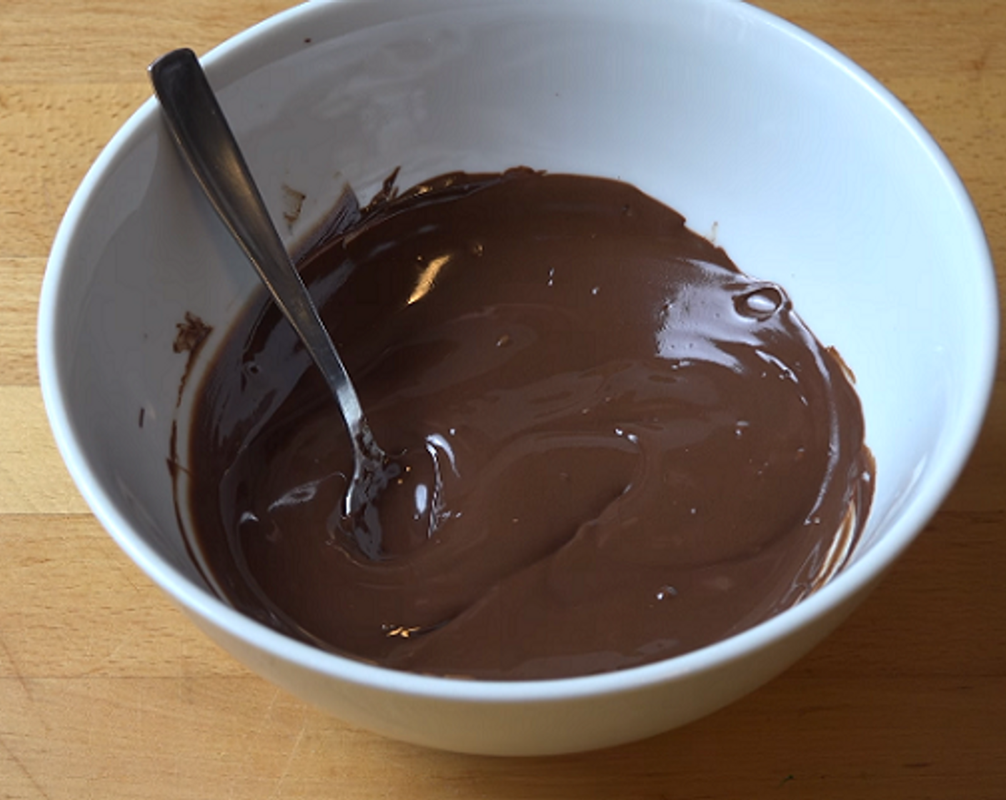 step 3 In a microwave-safe dish, add Semi-Sweet Dark Chocolate (1 3/4 cups). Microwave in 30-second bursts, stirring between each round until completely melted. Set aside to cool.