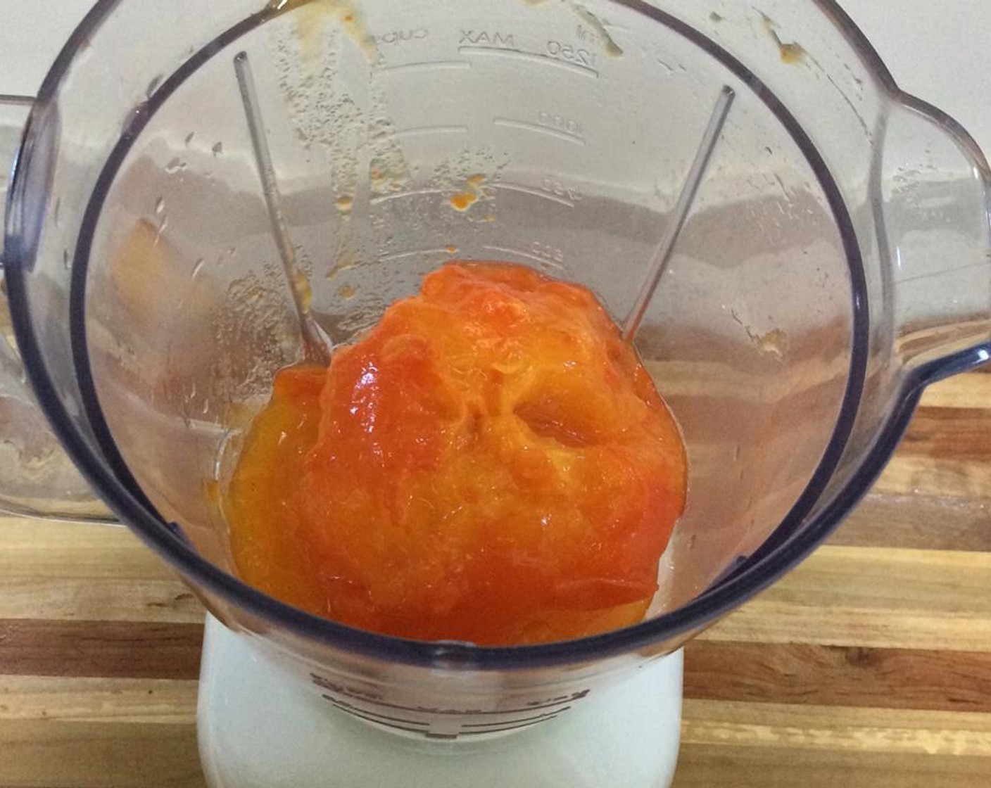 step 2 Peel the Persimmons (2) carefully and add them to a blender and puree.
