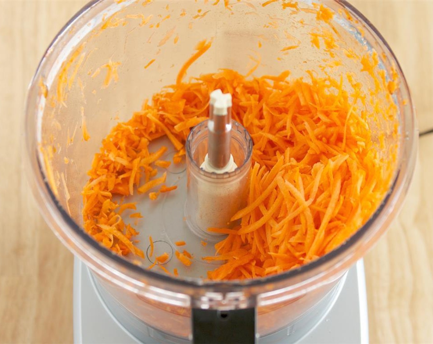step 3 Fit the food processor with the grater attachment and grate the Carrots (1 1/2 cups). Set aside with the broccoli.