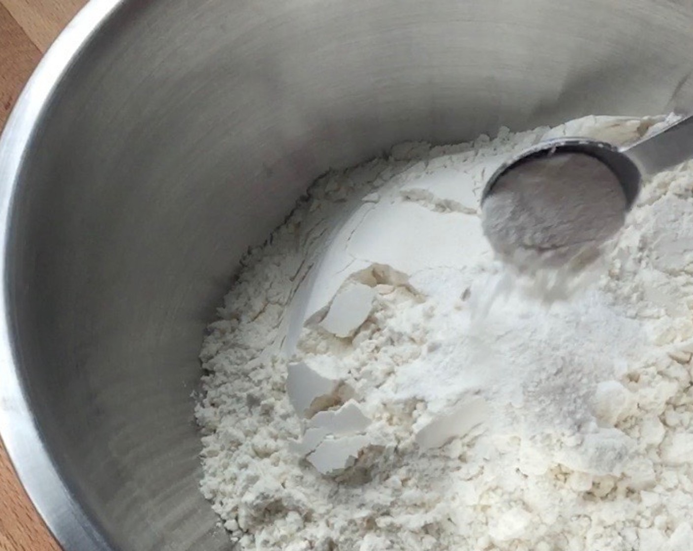 step 9 In a medium-size mixing bowl, mix All-Purpose Flour (250 g) and Baking Powder (1 Tbsp).